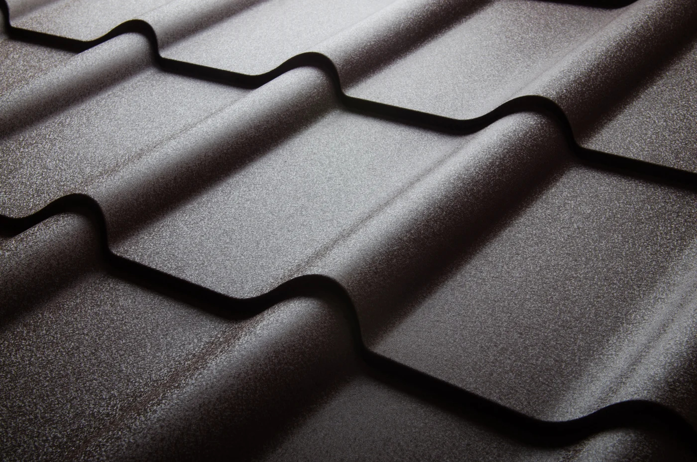 Stay Cool With Metal Roofing | Brinkmann Quality Roofing Services Close up of metal roof tile on a house in Houston installed by Brinkmann Quality Roofing Services.