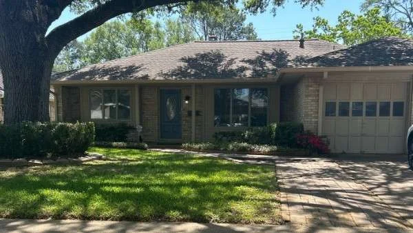 Wide view of Diana’s Houston-area home with her Brinkmann roof fully intact.