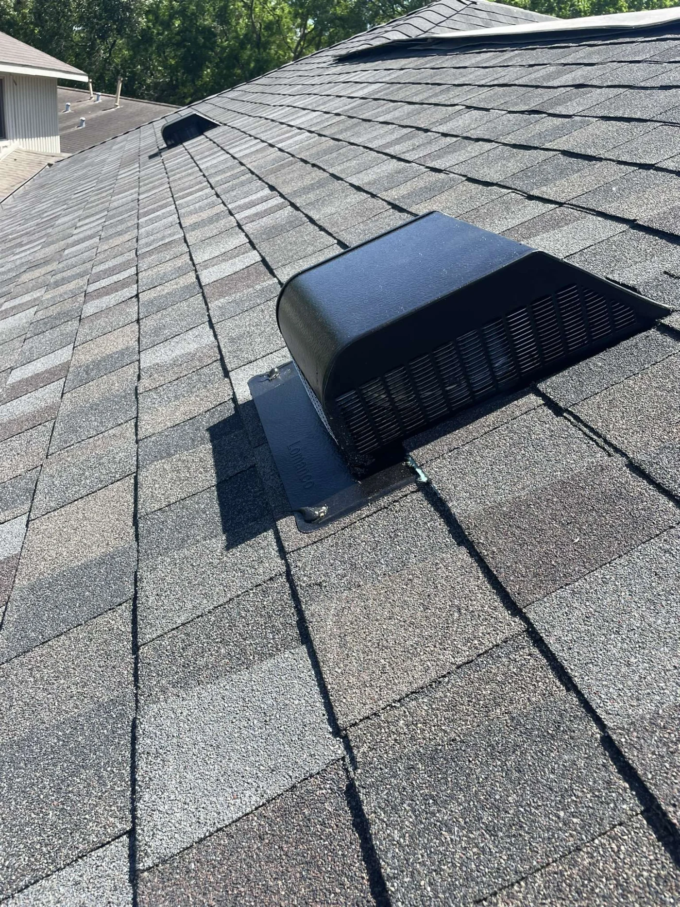 Prompt Roof Repairs In Seabrook, TX | Brinkmann Quality Roofing Services A close-up of rain gutters along a metal shingle roof.