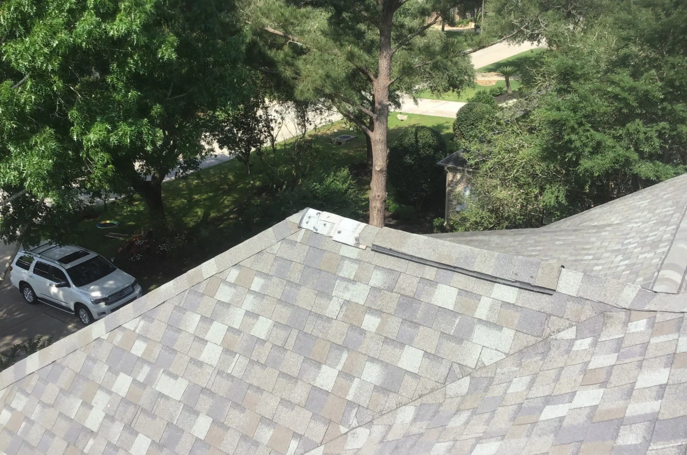 Expert Roof Maintenance Friendswood Tx Brinkmann Quality Roofing Services A closeup of a roof in Friendswood, TX requiring roof maintenance