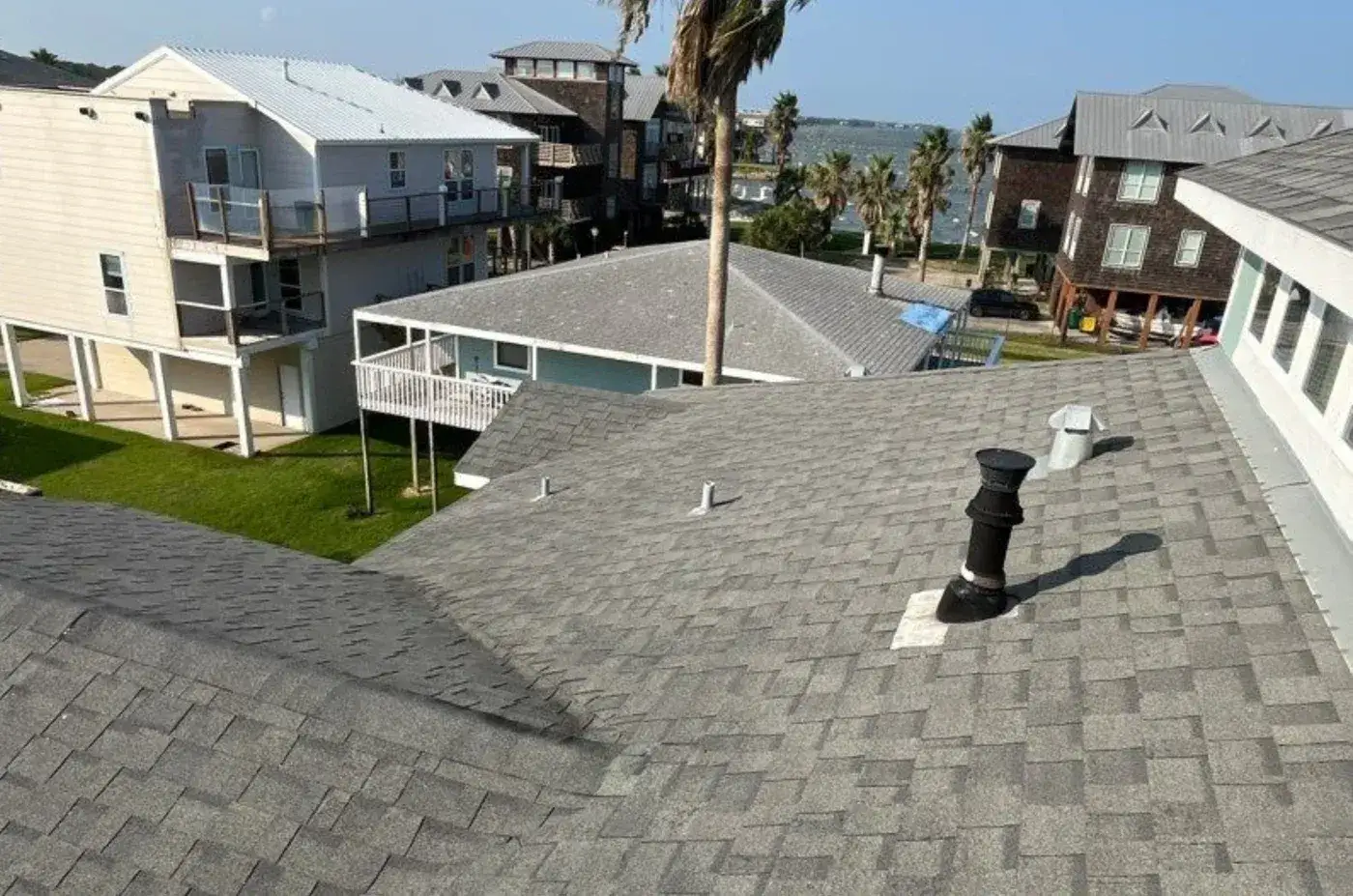 Preventative Roof Maintenance Seabrook Tx Brinkmann Quality Roofing Services A house with an asphalt shingle roof on the bay near Seabrook, TX.