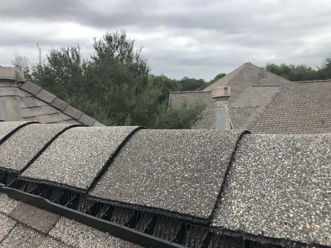 130mph hip ridge shingle gaf timbertex crucial roof component over cobravent II ridgevent trim weathered wood katy tx