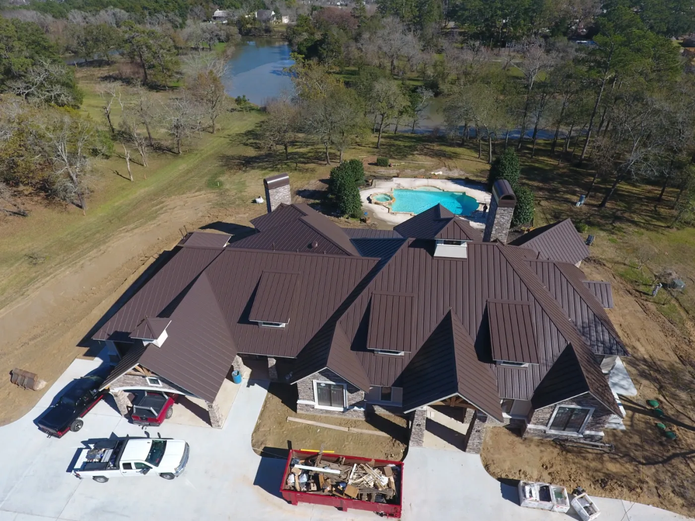 New contruction metal standing seam roof installation Berridge Aged bronze diamond lock tdi approved baytown tx