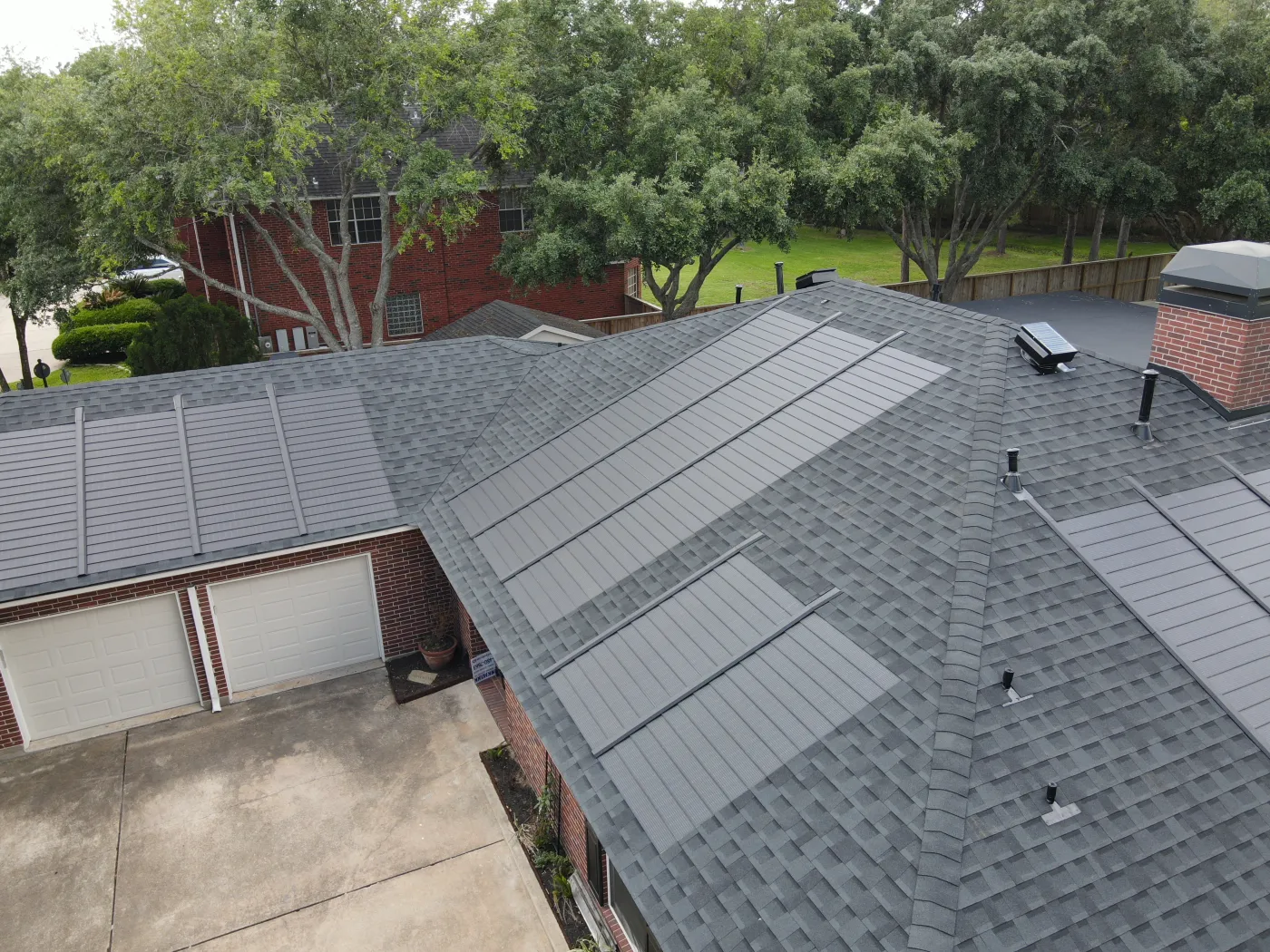 Roof replacment with solar shingles GAF code lead jacks attic breeze custom chimney cap golden pledge harris county houston tx