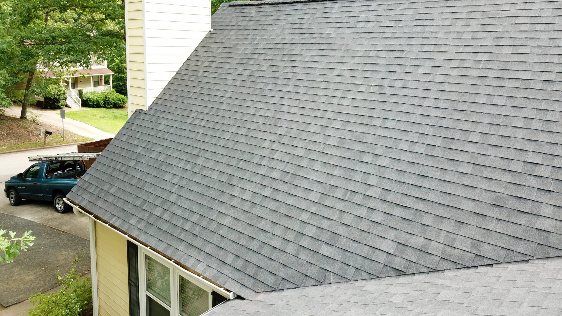 Closeup of a clean gray asphalt shingle roof